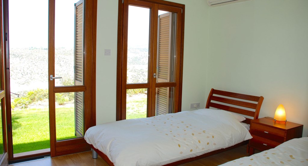 Junior Villa EZ02 - Twin room opening out to the garden. Aphrodite Hills Resort, Cyprus.
