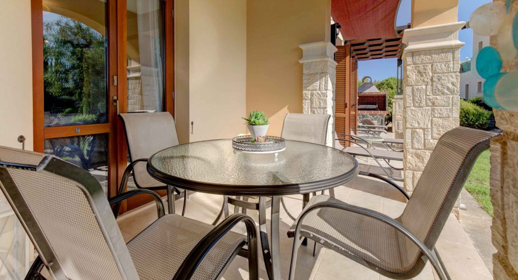 17. Luxury holiday apartment Aphrodite Hills Resort Cyprus_Outside Breakfast Table.jpg