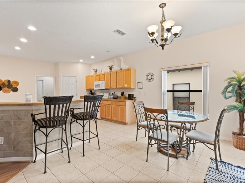 Breakfast area that seats up to 4 people and bar area that seats up to 2 people