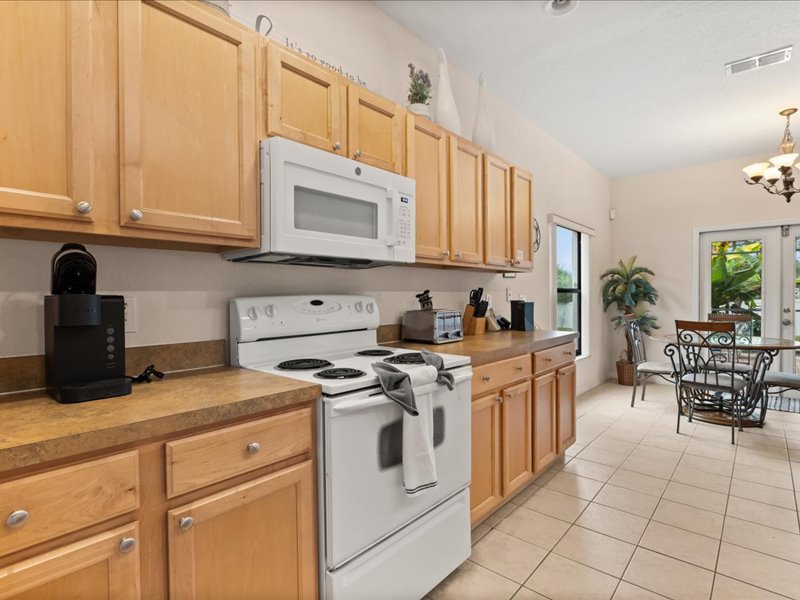 Kitchen view of the stove and microwave