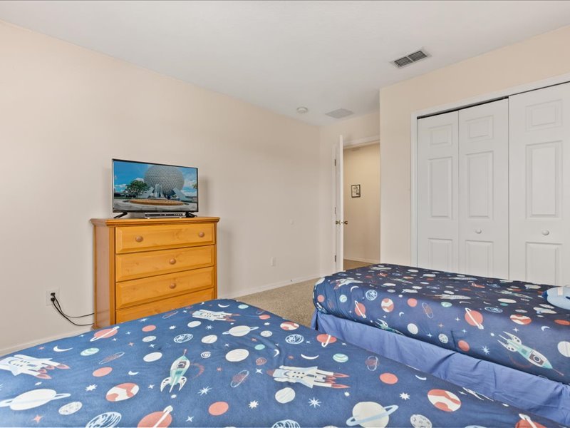 Bedroom # 3 with 2 twin beds and a TV