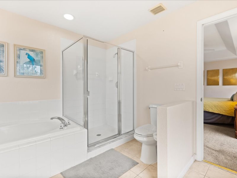Master bathroom with a toilet and a walk in shower