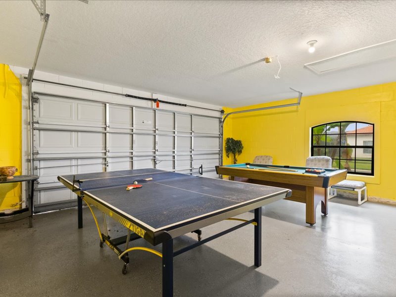Game room with table tennis and a pool table