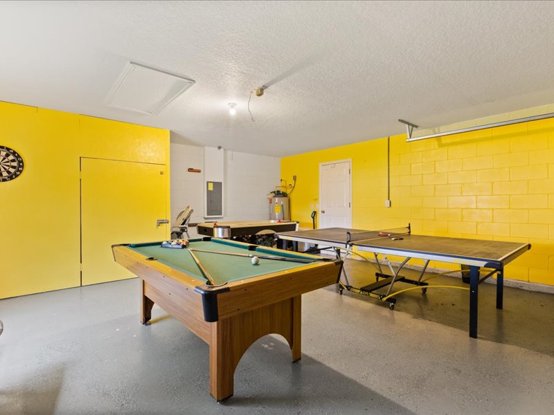 Game room with table tennis and a pool table