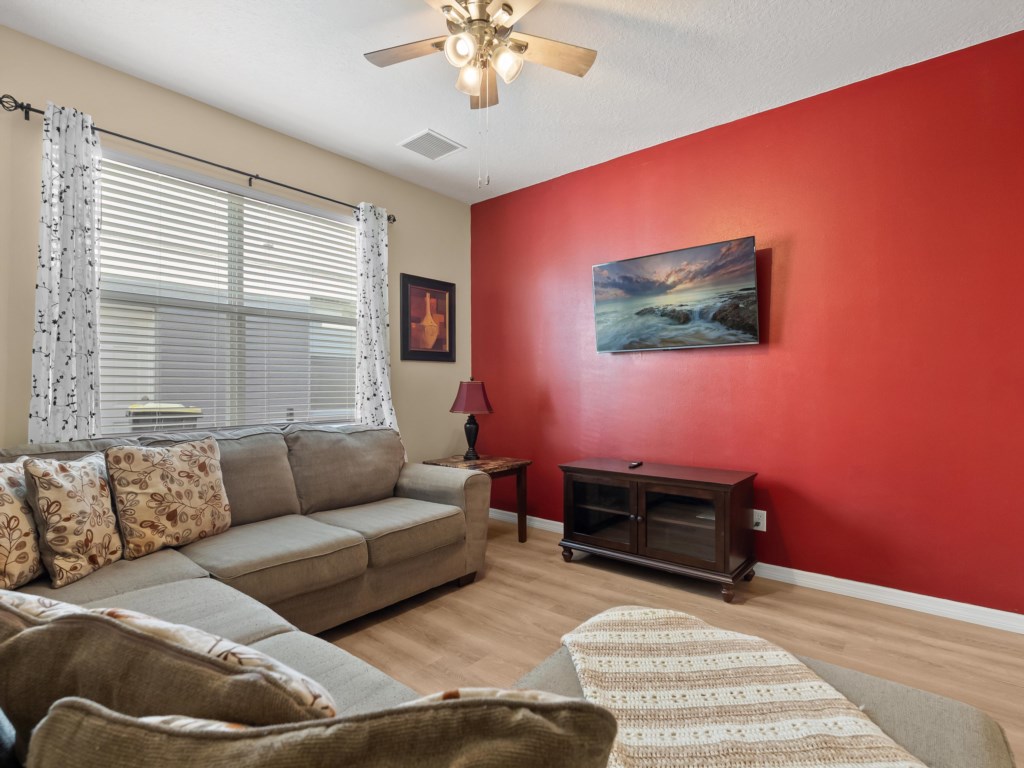 Second Living Room Area with A Sectional Sofa with TV