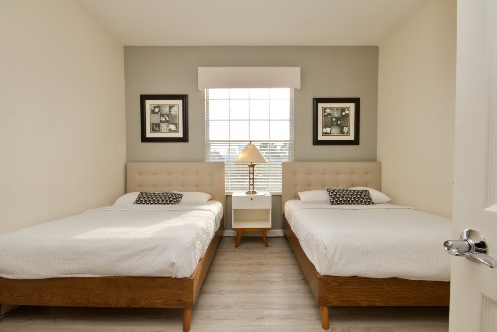 Double beds in guest bedroom
