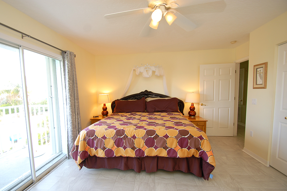 Master bedroom, the sliding glass doors lead out onto the south balcony providing views of the Gulf 