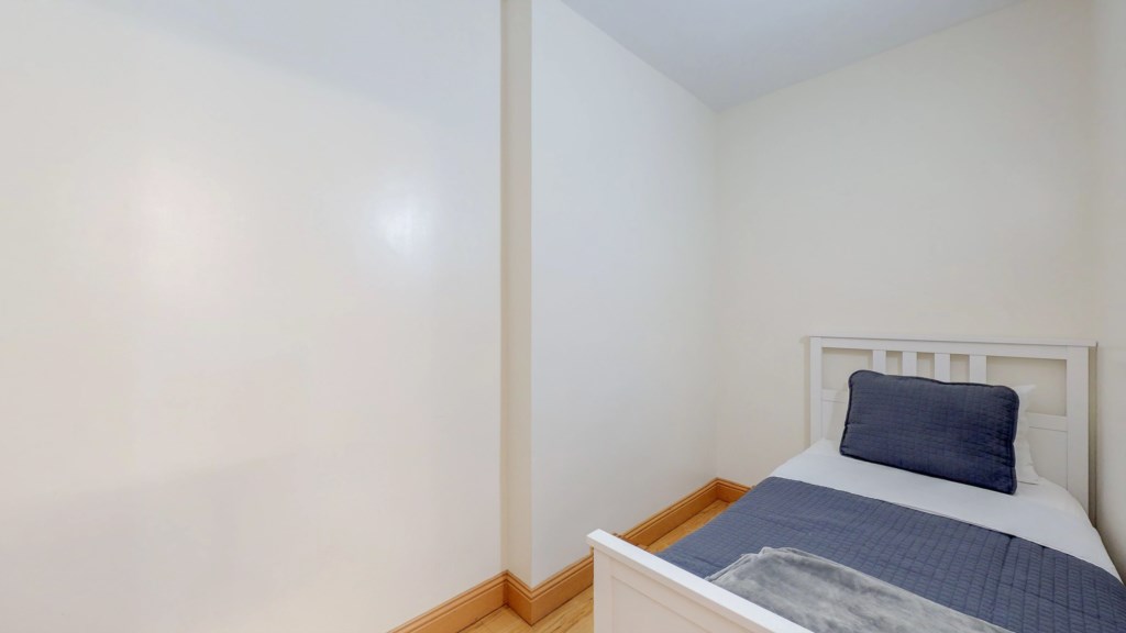 This unit was originally a 2BR. The walk-in closet was converted into a bedroom with 1 single bed.