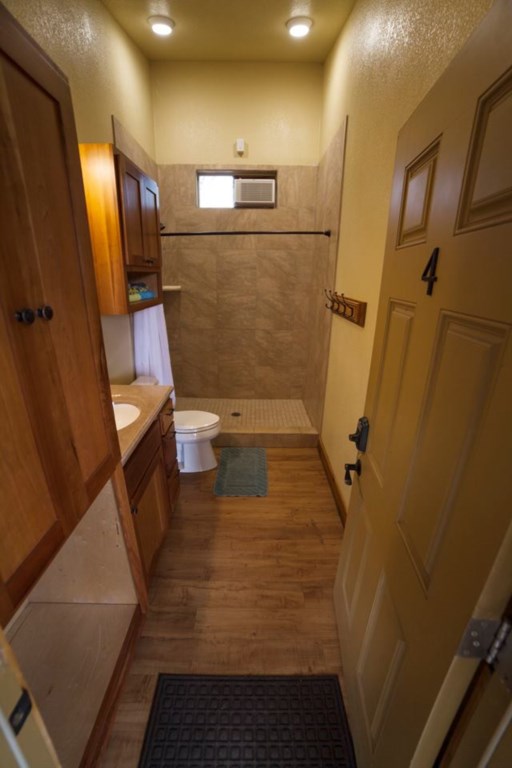 Clean, private bathrooms with tiled shower, sink and toilet.