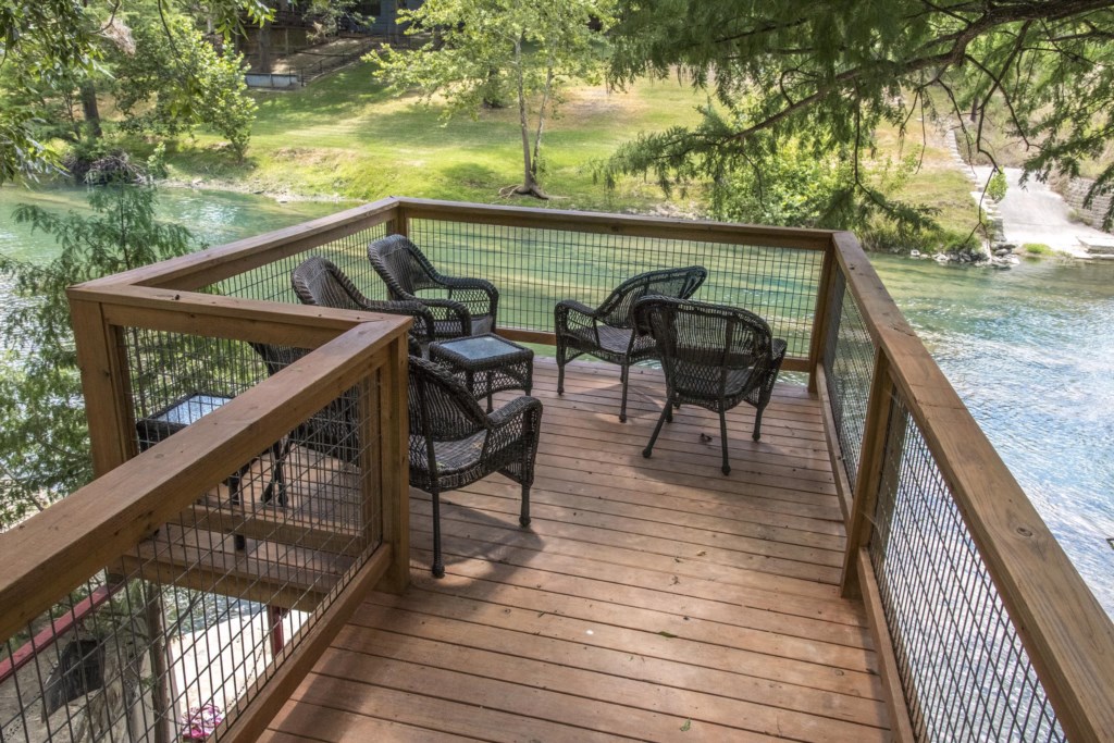The deck overlooks a beautiful spot on the river.