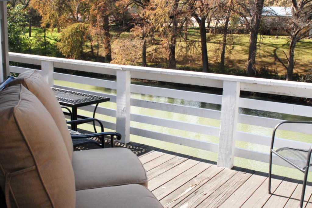 Relaxing deck overlooks the waterfront.