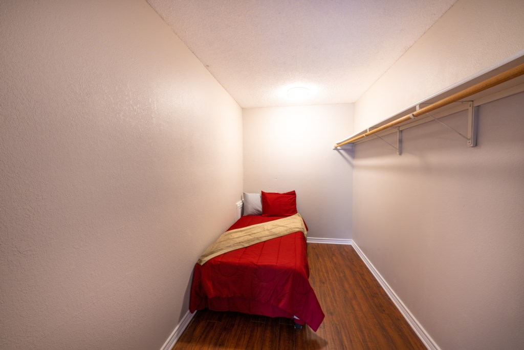 Closet hideout offers a twin bed - the kids will love it!