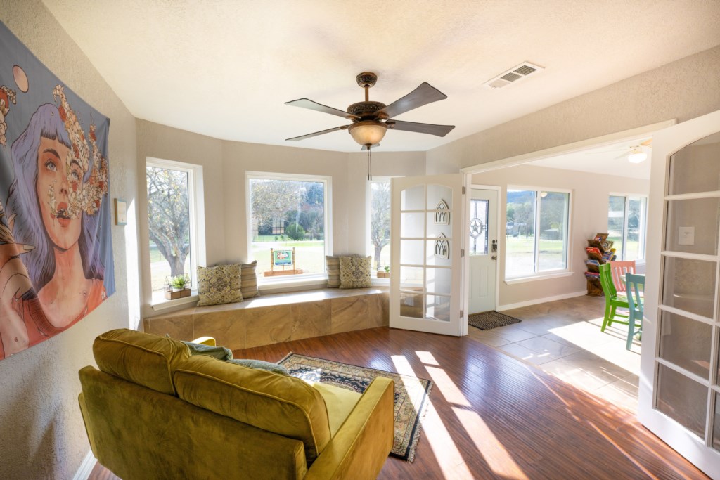 Great natural lighting in our spacious living room with outdoor views. Watch the deer play!