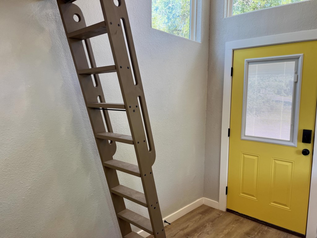 View of the ladder that leads to the sleeping loft.