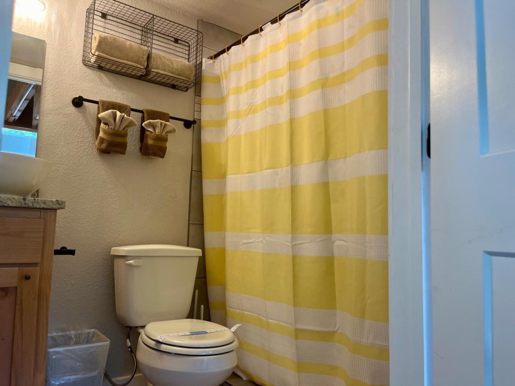 Full bathroom with plumbed toilet, tiled shower!