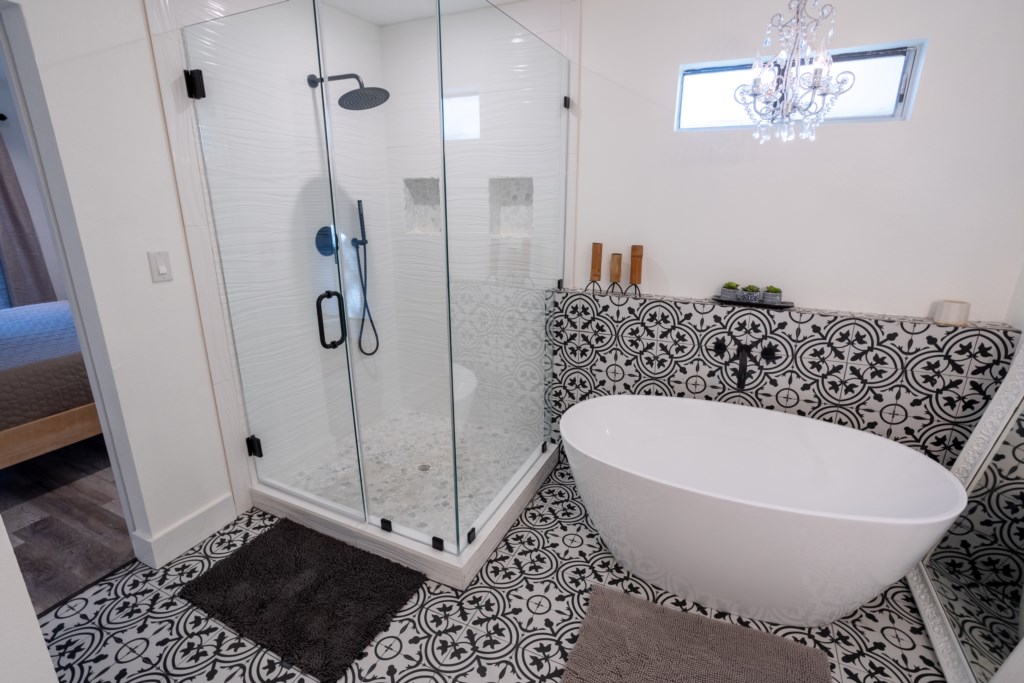 Glassed shower with gorgeous touches throughout.