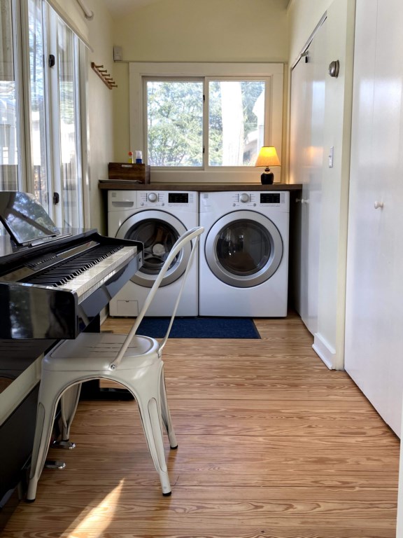 Full size washer and dryer, with folding table above. 