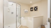 Enjoy a leisurely soak in the garden tub or a quick rinse in the large shower.