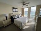 The master bedroom offers a glorious king size bed and access to the balcony.