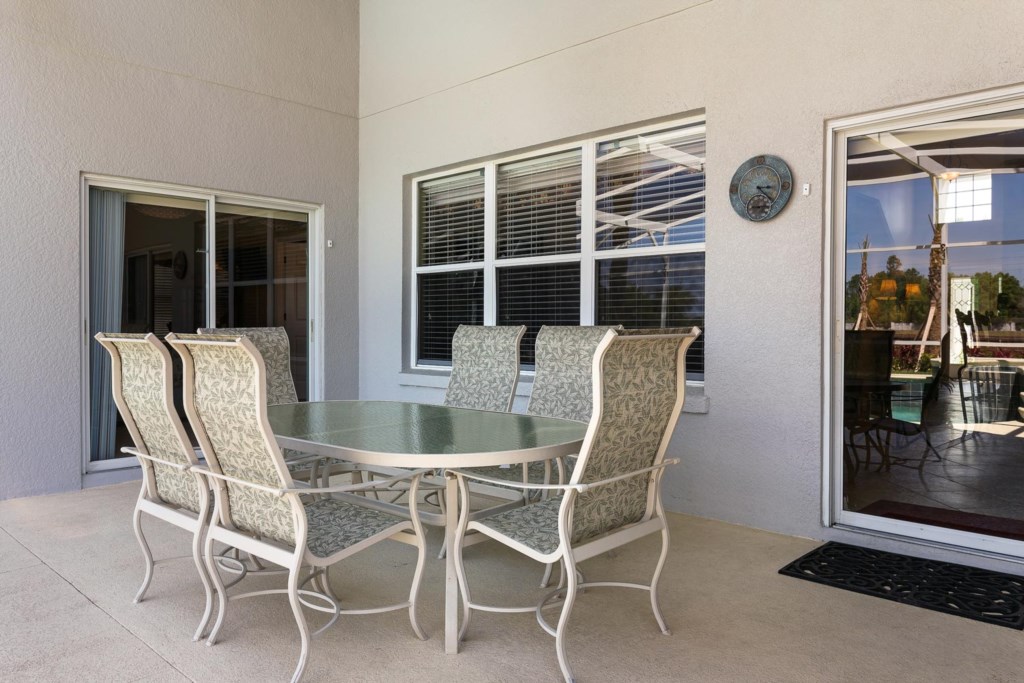 Enjoy a casual outdoor meal in the shade of the covered lanai