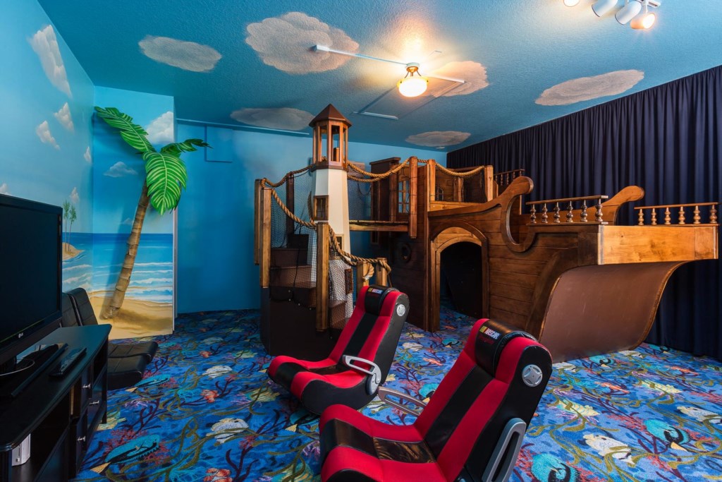 Kids will love the pirate-themed game room with pirate ship play center and 42-inch TV