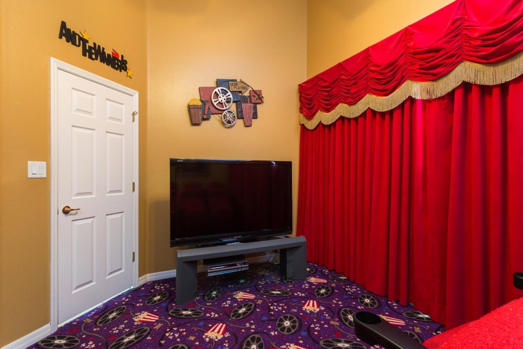 Watch movies in the home theater with 65-inch TV