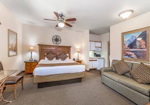 Crest_Pointe_Studio_with_1_King_Bed_living_room_bed_and_kitchenette