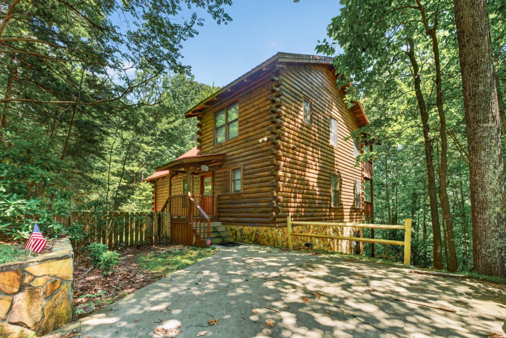 Charming log cabin nestled in the woods, perfect for a peaceful retreat.