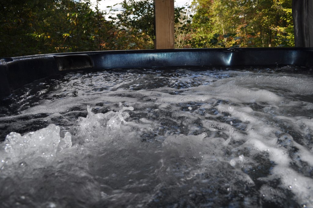 Soak your cares away in the spacious hot tub