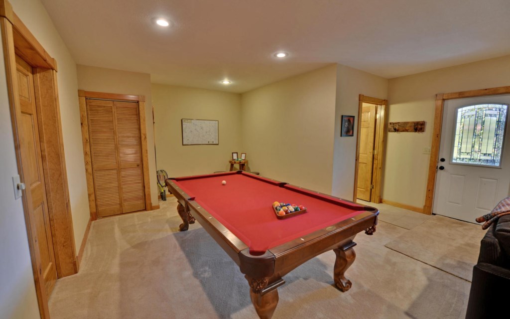 Full size pool table in the terrace level game room