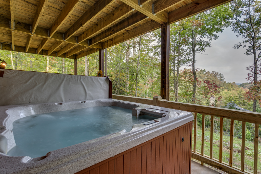 Soak away the days adventures in the covered steaming Hot Tub