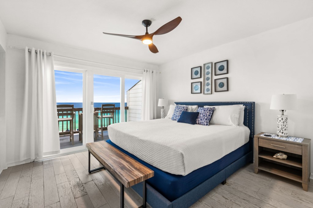 Ocean-view bedroom with private balcony, ideal for relaxing mornings and stunning sunsets.