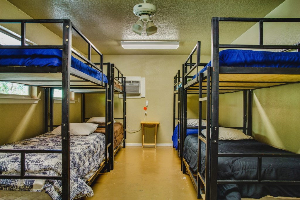 Bunk Bedroom with 5 Bunk Beds and pull out counch offering sleep for 12 people