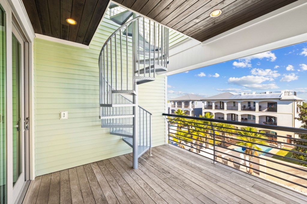 3rd Floor Balcony with Spiral Staircase Leading to Rooftop Deck