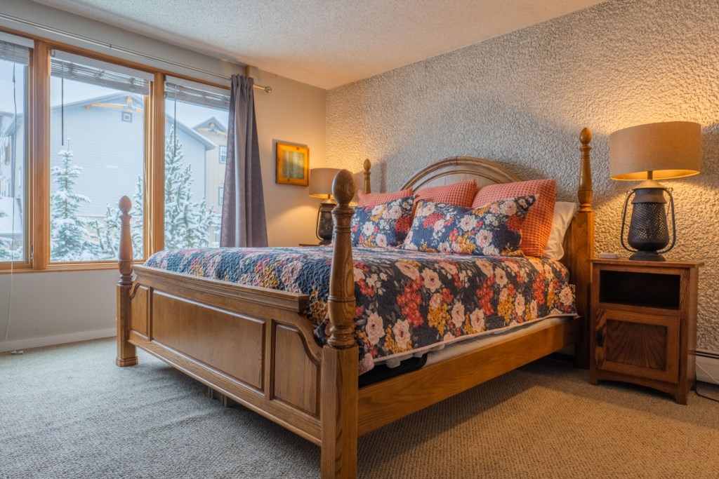 2nd floor ensuite bedroom with a King sized bed and wood burning fireplace