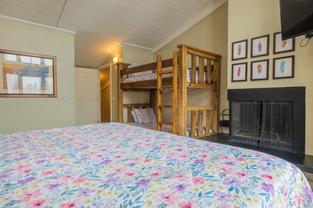 Third floor primary bedroom with King bed and twin xl bunk beds