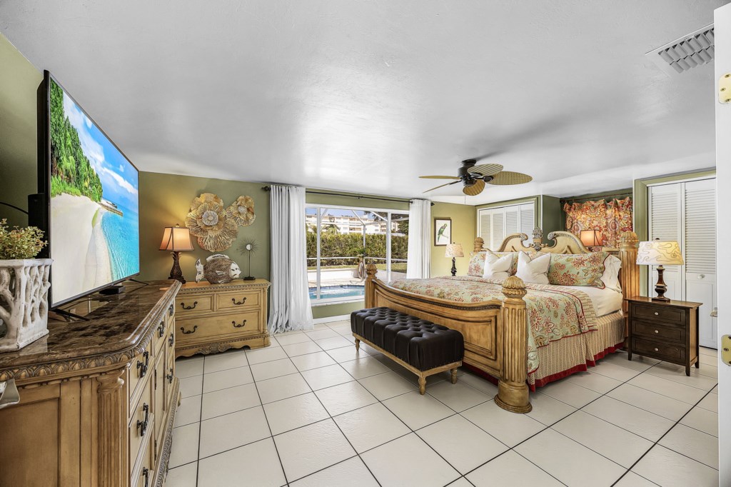 Large TV with Xfinity cable and pool views