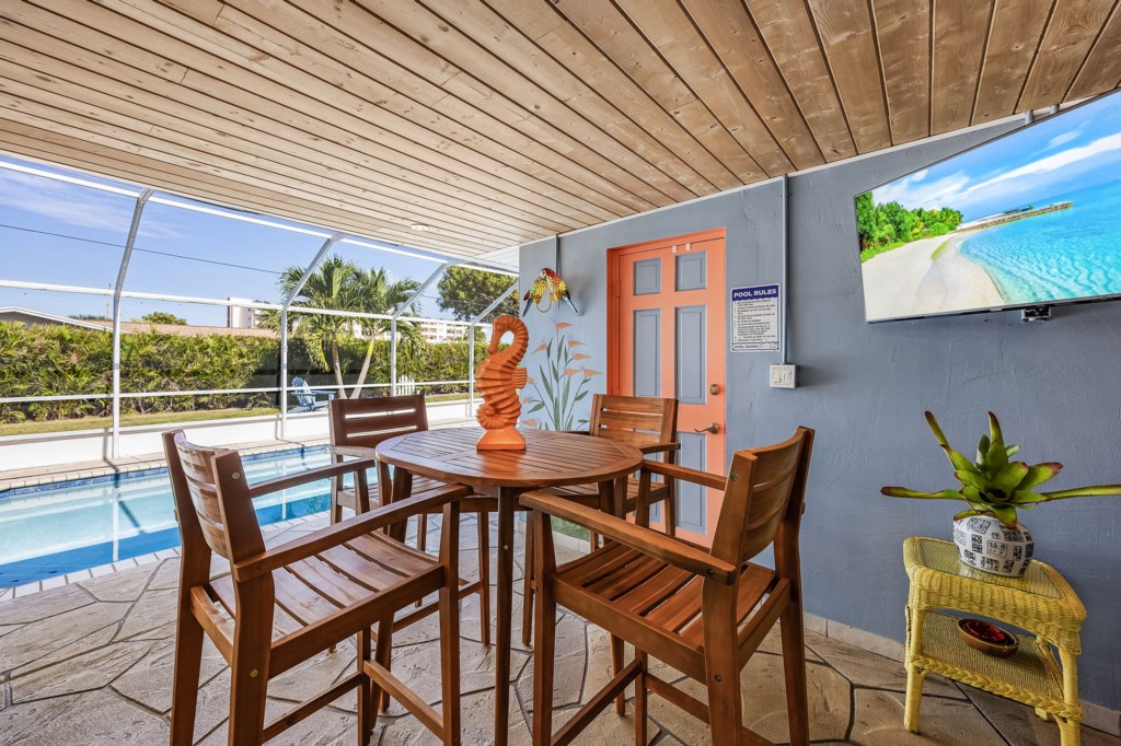 Catch a movie or sports in the pool 