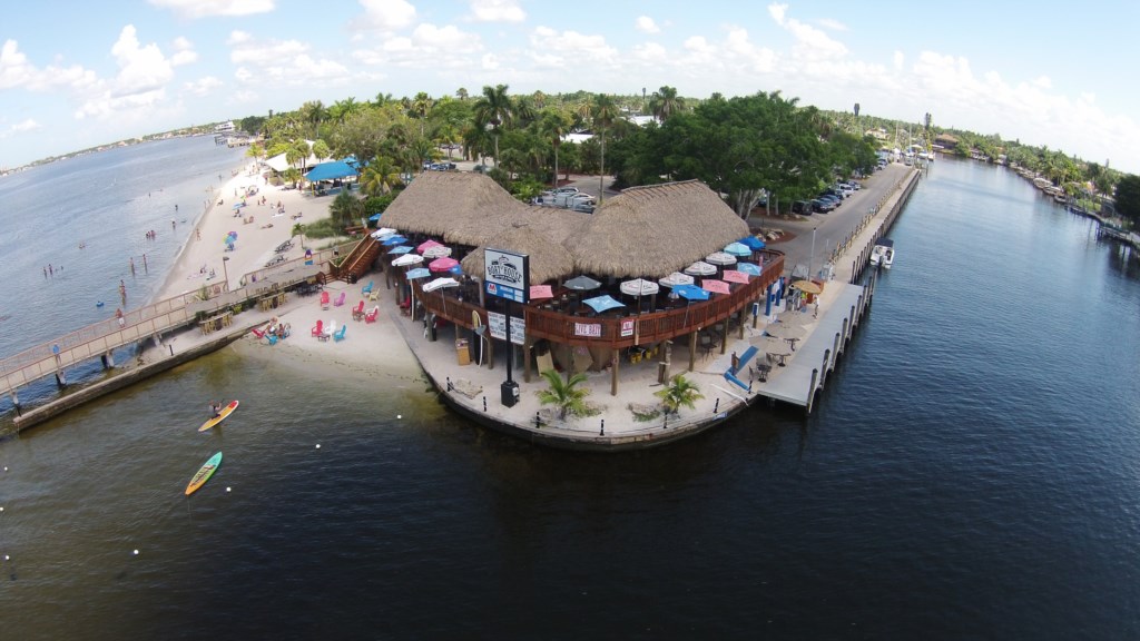 The Tiki Bar and Grill in the Yacht Club with public beach