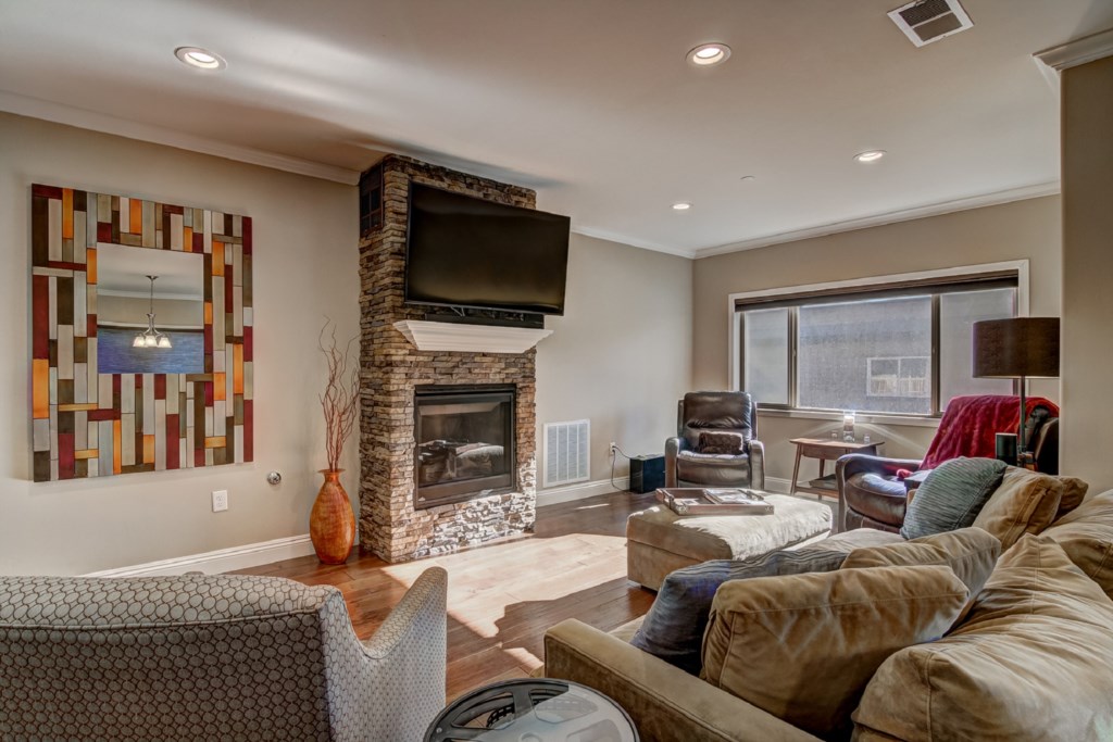 This home features a spacious open floor plan with stone fireplace