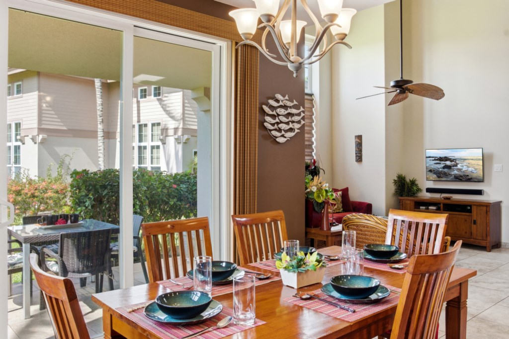 Elegant dining area with patio access, perfect for enjoying meals with a view.