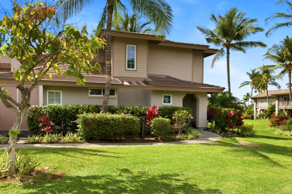 Tropical getaway with lush landscaping and palm trees, perfect for a relaxing vacation.