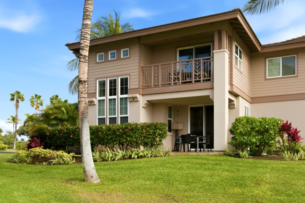 Charming patio and balcony with lush garden views, perfect for relaxation.
