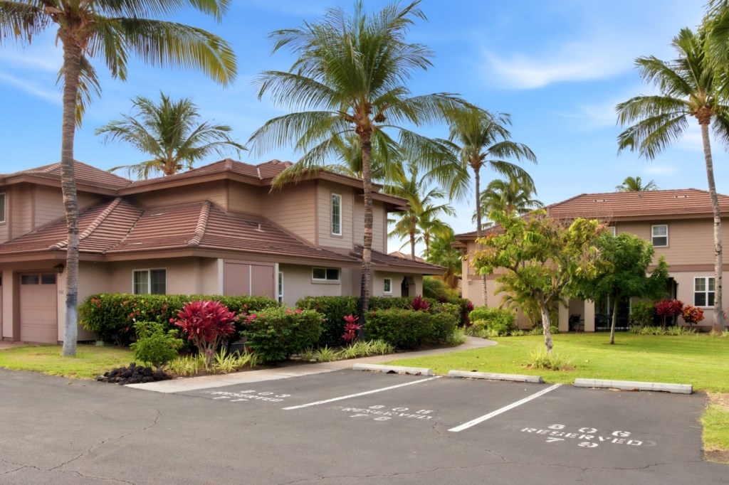 Tropical villa with lush landscaping and private parking, perfect for a relaxing getaway.