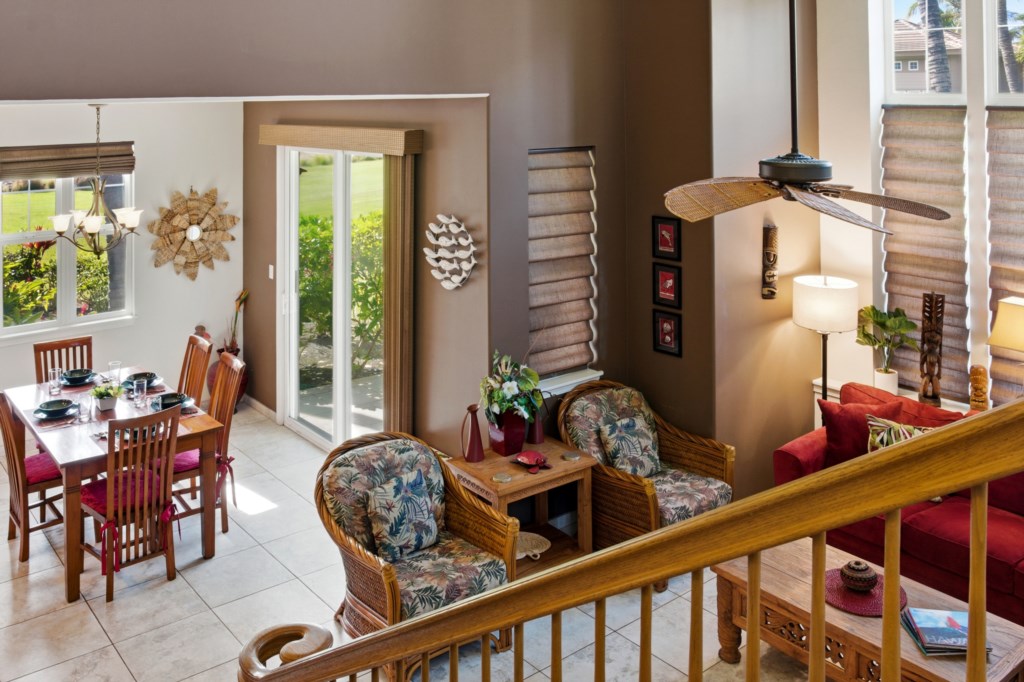 Open living and dining area with garden views and cozy seating.