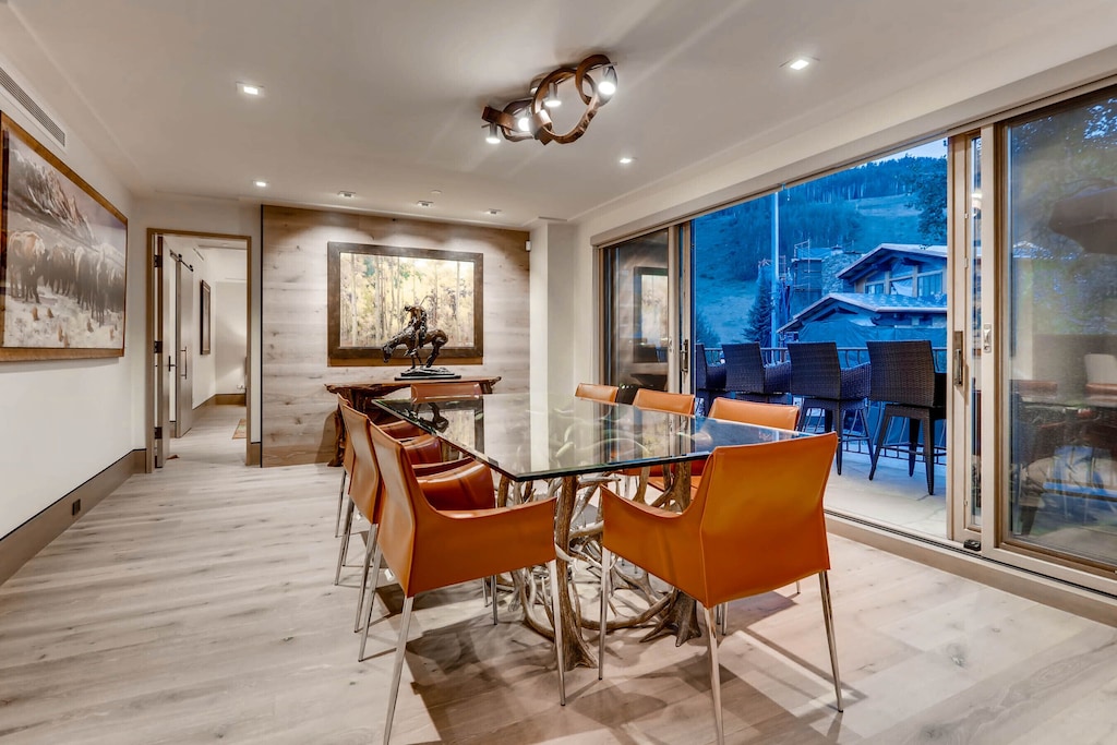 Dining room with balcony facing mountains