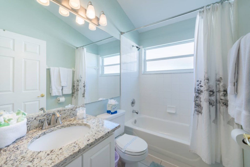 Family bathroom with granite countertops.jpg