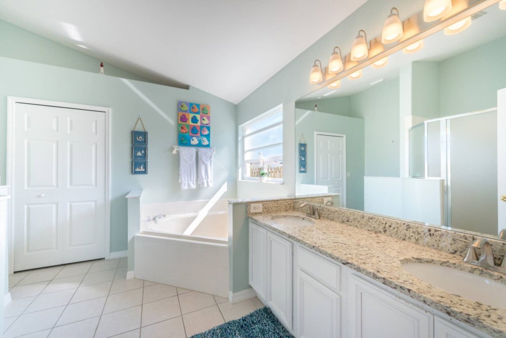 Master bedroom ensuite bathroom with granite countertops.jpg