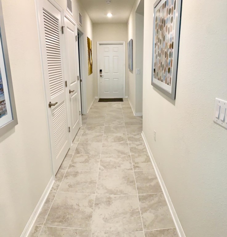 Entry way with washer and dryer in closet