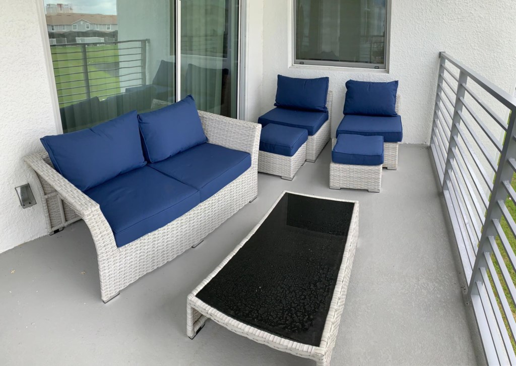 Private outdoor balcony with lounge furniture perfect for morning cup of coffee!